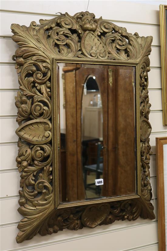 A Flemish gilt carved oak mirror, H.90cm